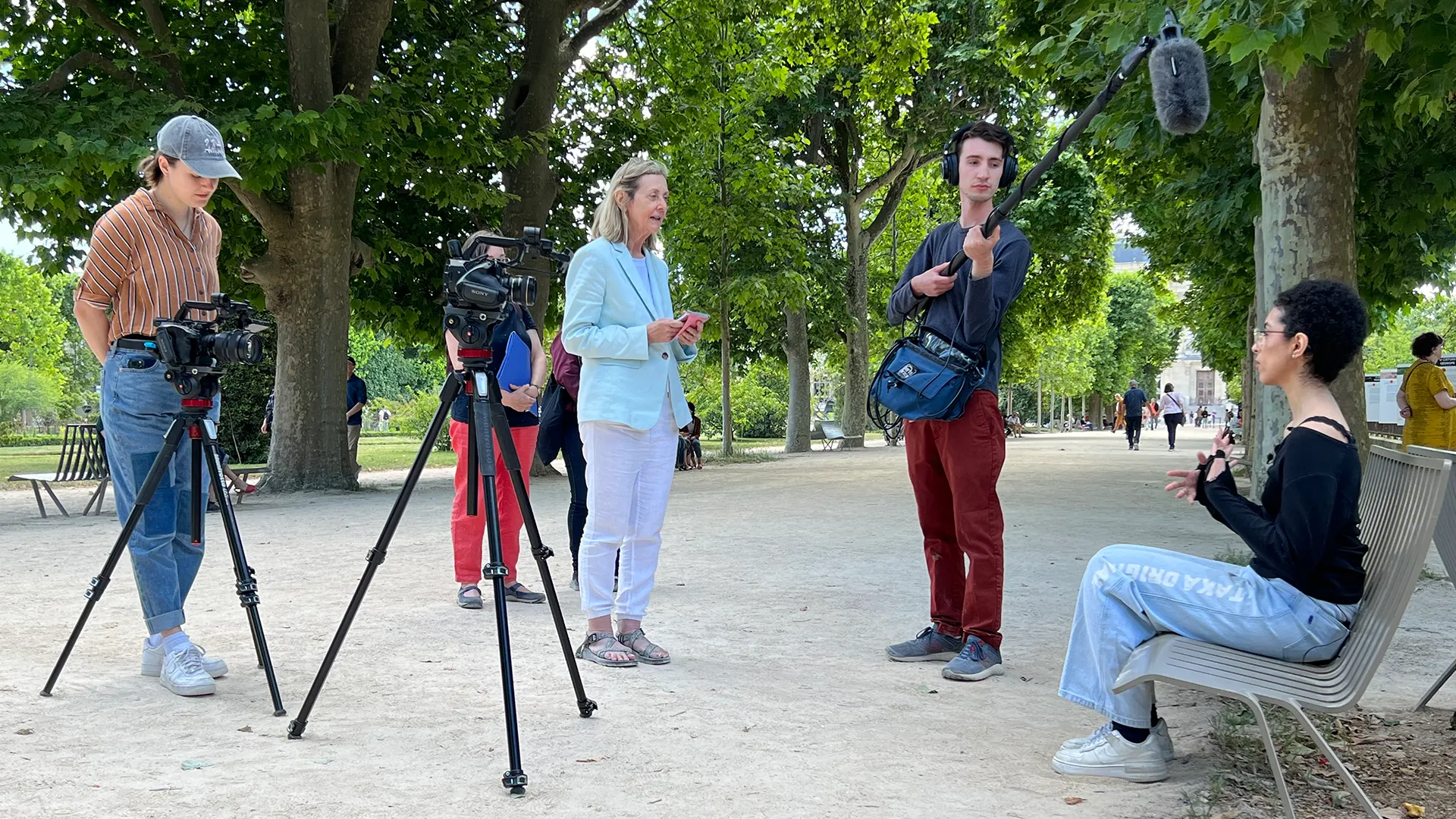 A production crew films at a French park